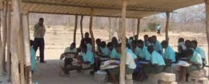 Students taking lessons in a makeshift classroom